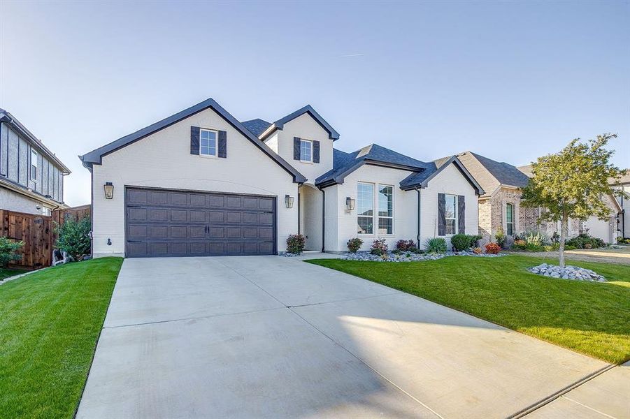 Front exterior of a new home in M3 Ranch 60s, Mansfield, TX, highlighting curb appeal (Image 22).