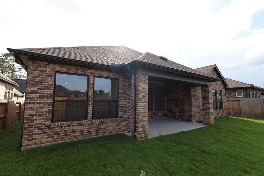 Front exterior of a new home in Riceland 60’ Homesites, Mont Belvieu, TX, highlighting curb appeal (Image 17). Front exterior of a new home in Riceland 60’ Homesites, Mont Belvieu, TX, highlighting curb appeal (Image 17).