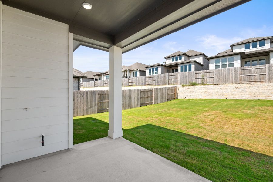 Exterior details and patio area of a home in Lariat, Liberty Hill (Image 4).