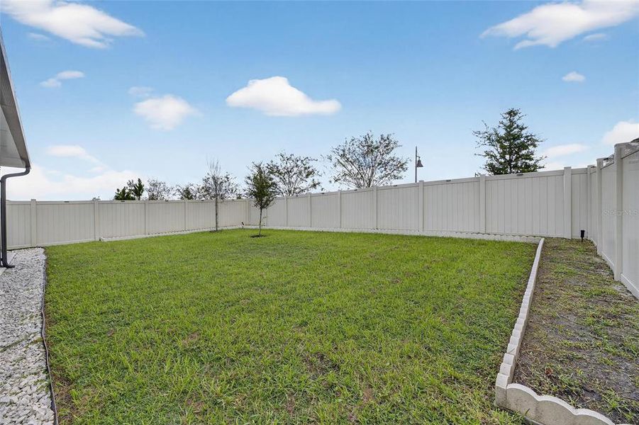Exterior details and patio area of a home in North Park Isle, Plant City (Image 4).