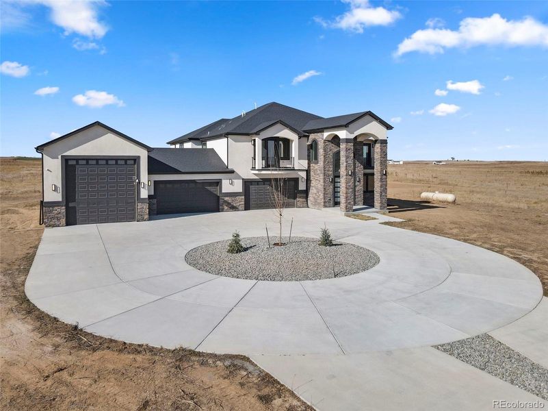 Front exterior of a new home in , Hudson, CO, highlighting curb appeal (Image 1).