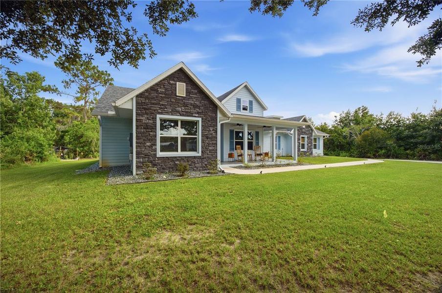 Front exterior of a new home in , Wesley Chapel, FL, highlighting curb appeal (Image 26). Front exterior of a new home in , Wesley Chapel, FL, highlighting curb appeal (Image 26).