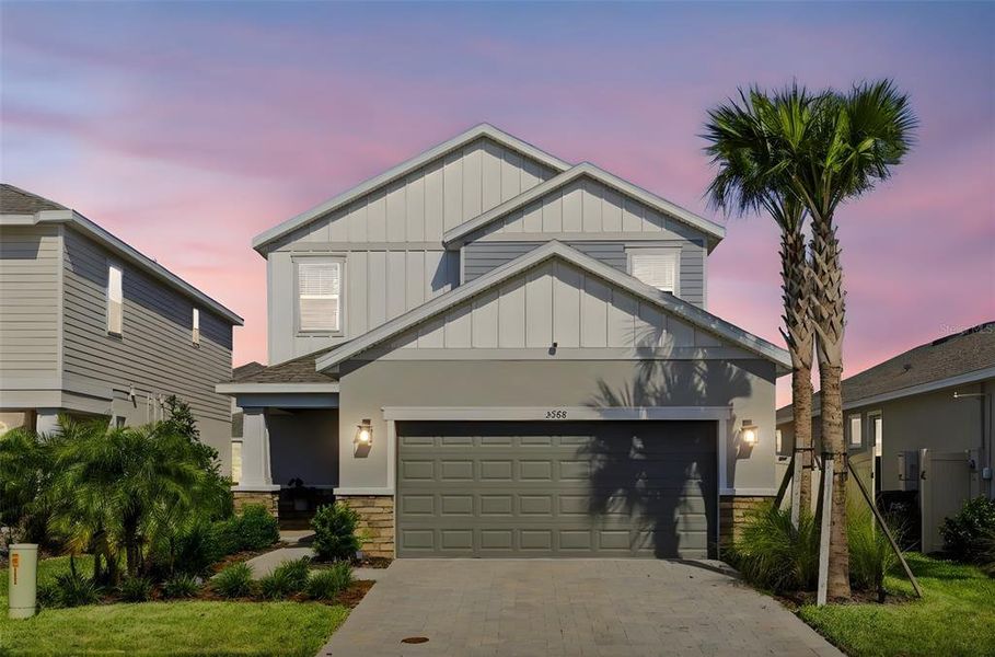 Front exterior of a new home in Center Lake Ranch Community Group Page, St. Cloud, FL, highlighting curb appeal (Image 2). Front exterior of a new home in Center Lake Ranch Community Group Page, St. Cloud, FL, highlighting curb appeal (Image 2).