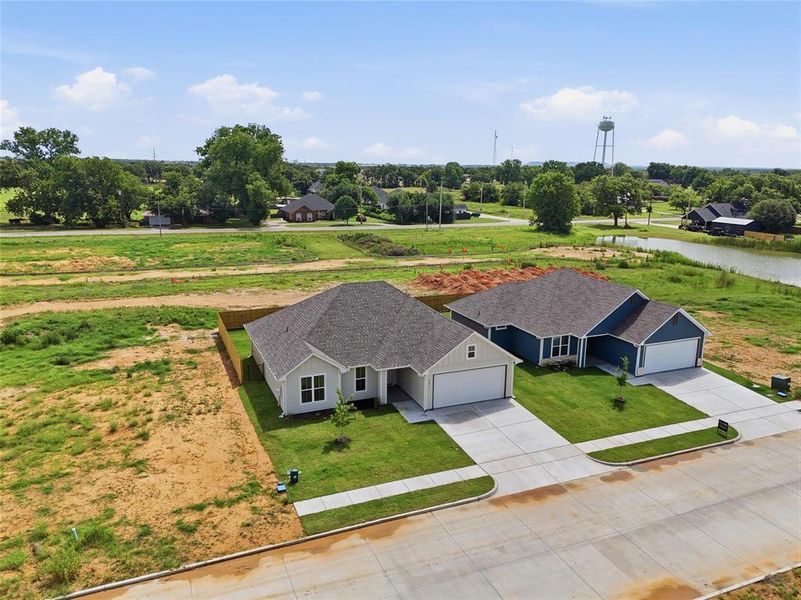 Front exterior of a new home in , Tolar, TX, highlighting curb appeal (Image 25).