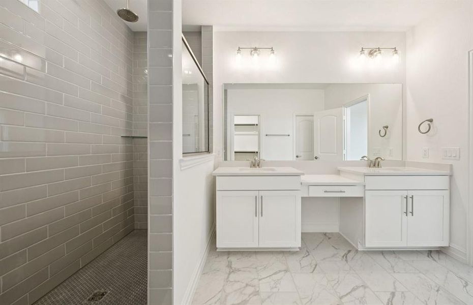Deep walk-in shower designed for relaxation in the owner's bath  *Real home pictured