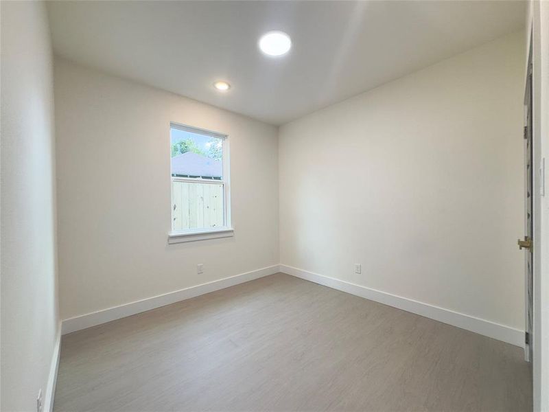 Spare room with light hardwood / wood-style flooring