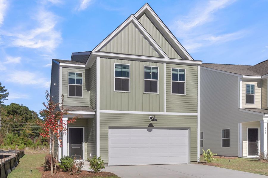 Front exterior of a new home in Wildcat Chase, Summerville, SC, highlighting curb appeal (Image 1). Front exterior of a new home in Wildcat Chase, Summerville, SC, highlighting curb appeal (Image 1).