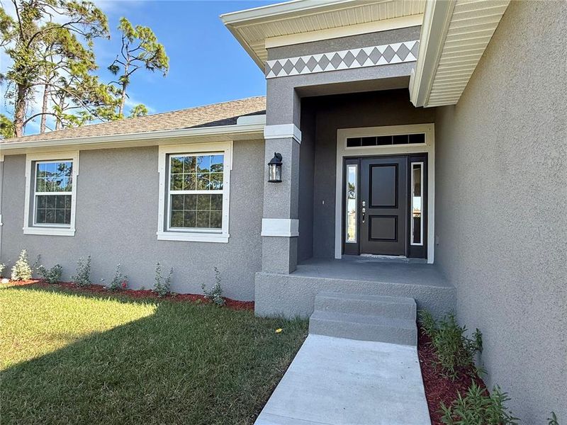 Exterior details and patio area of a home in Rotonda, Rotonda West (Image 14).
