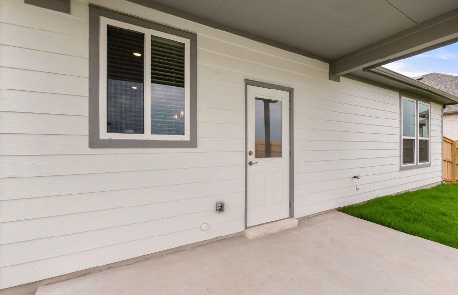 Front exterior of a new home in Patterson Ranch, Georgetown, TX, highlighting curb appeal (Image 24). Front exterior of a new home in Patterson Ranch, Georgetown, TX, highlighting curb appeal (Image 24).