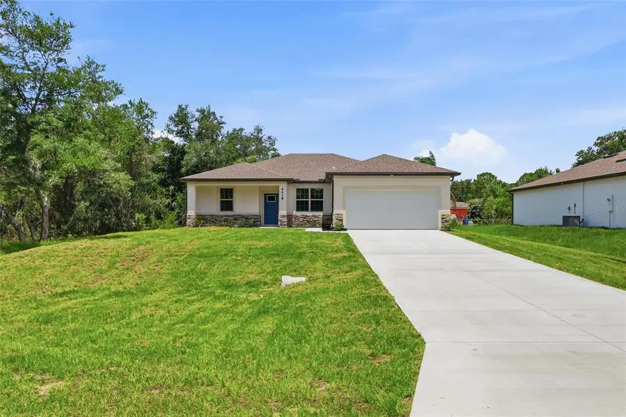 Front exterior of a new home in , North Port, FL, highlighting curb appeal (Image 15).