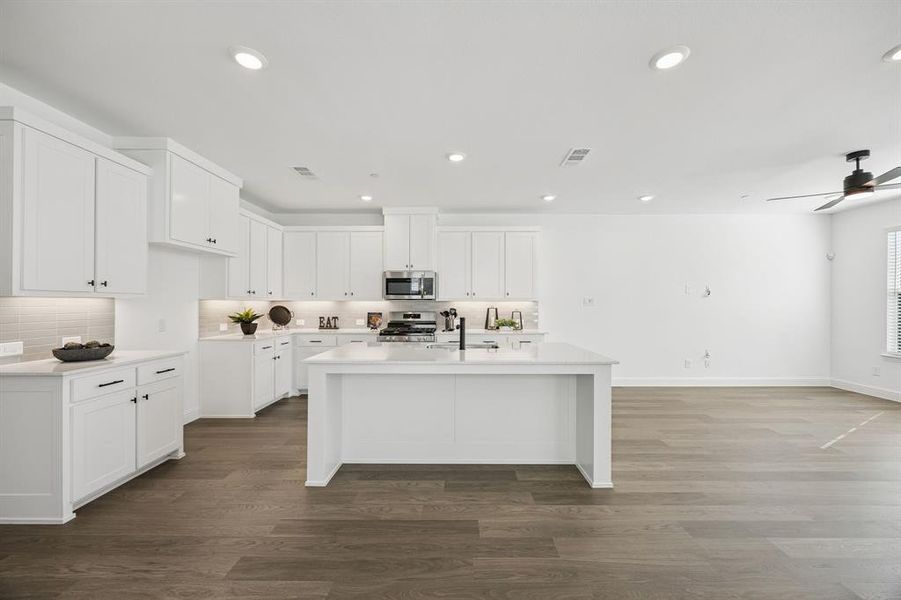 The spacious island offers the perfect place for friends and family to gather round!