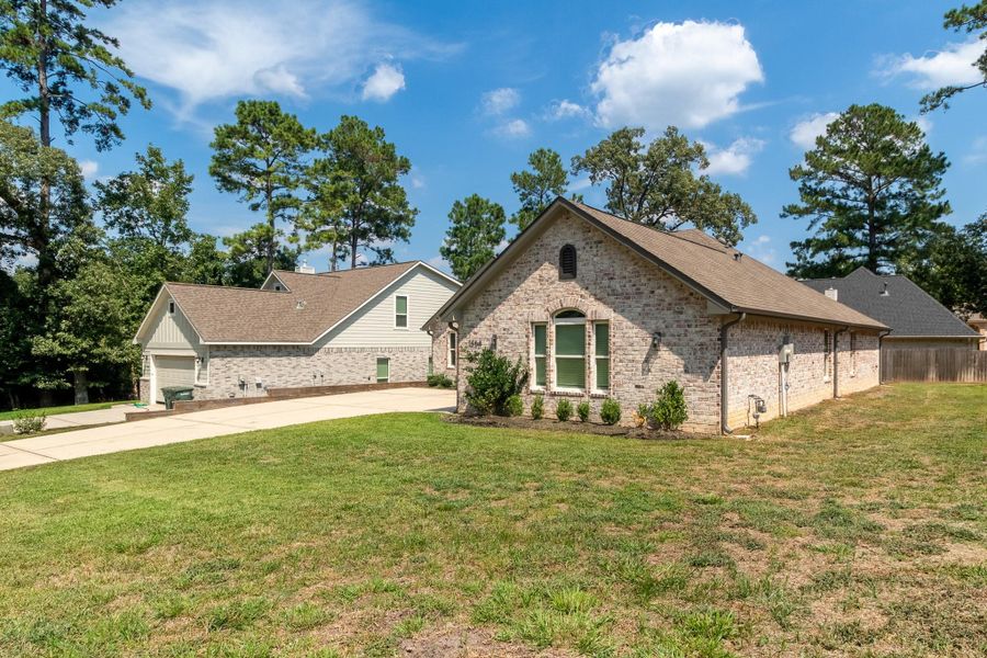 Front exterior of a new home in , Huntsville, TX, highlighting curb appeal (Image 18).