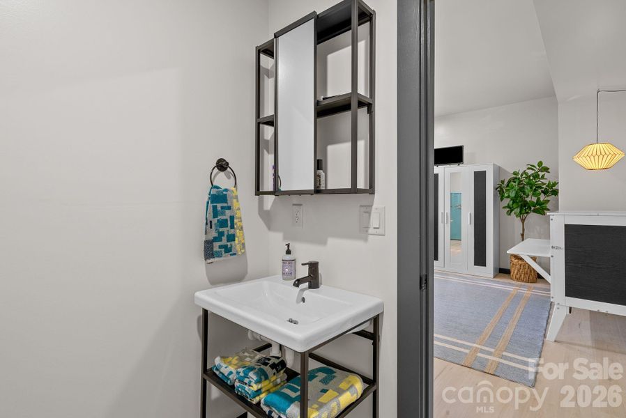 The lower level full bathroom in the studio apartment.