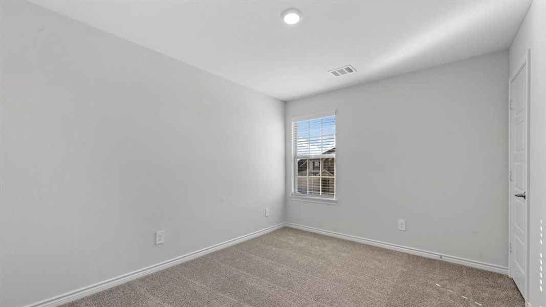 Empty room featuring carpet and baseboards Empty room featuring carpet and baseboards