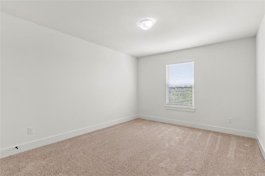 Unfurnished room featuring baseboards and light carpet Unfurnished room featuring baseboards and light carpet