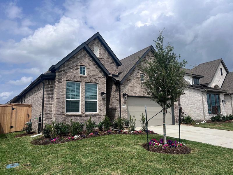 Front exterior of a new home in Wood Leaf Reserve, Tomball, TX, highlighting curb appeal (Image 16).