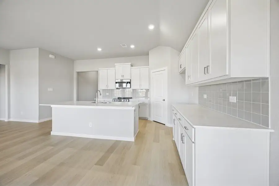 Representative furnished interior of a home built from the The Elm by Lillian Custom Homes in Hickory Hill, Sherman (Image 12).