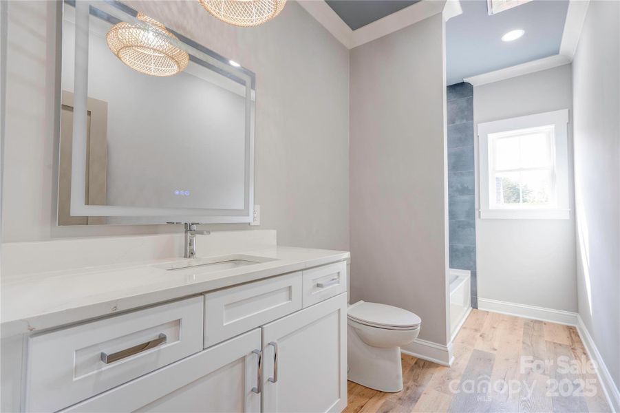 Hall Full Bathroom with quartz countertops