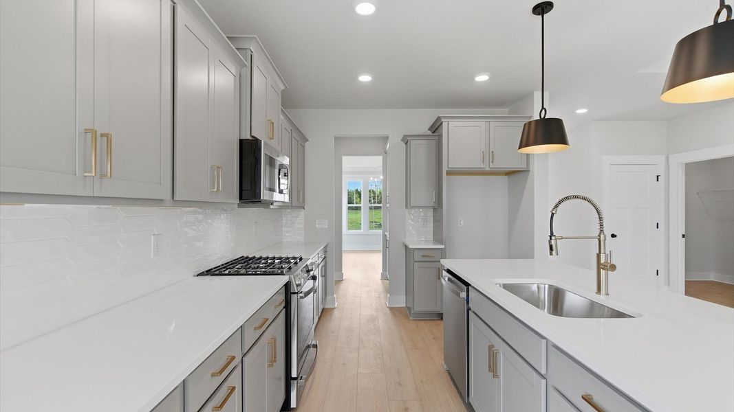 Memorable meals begin in this vibrant kitchen with pendant lighting and a thoughtfully designed island in Gray Court, SC