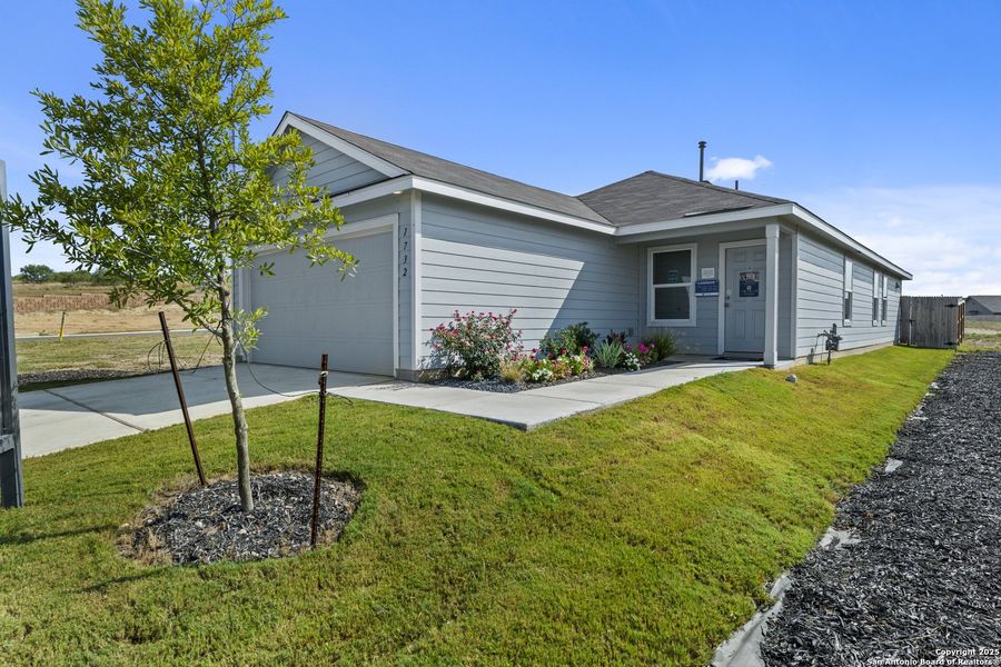 Front exterior of a new home in , New Braunfels, TX, highlighting curb appeal (Image 2).
