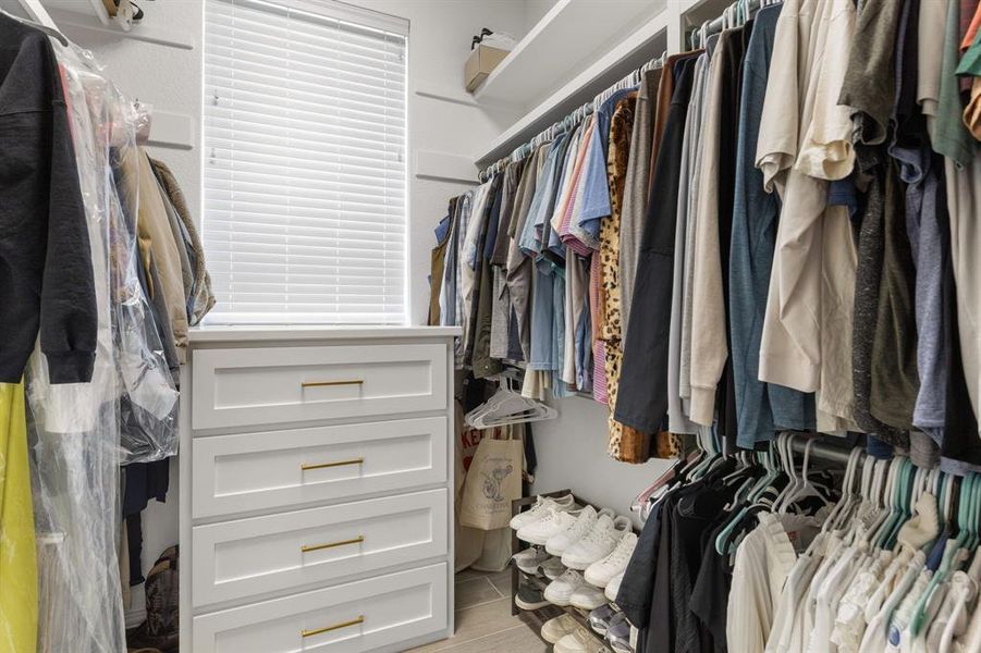 Spacious closet featuring wood tiled floors Spacious closet featuring wood tiled floors