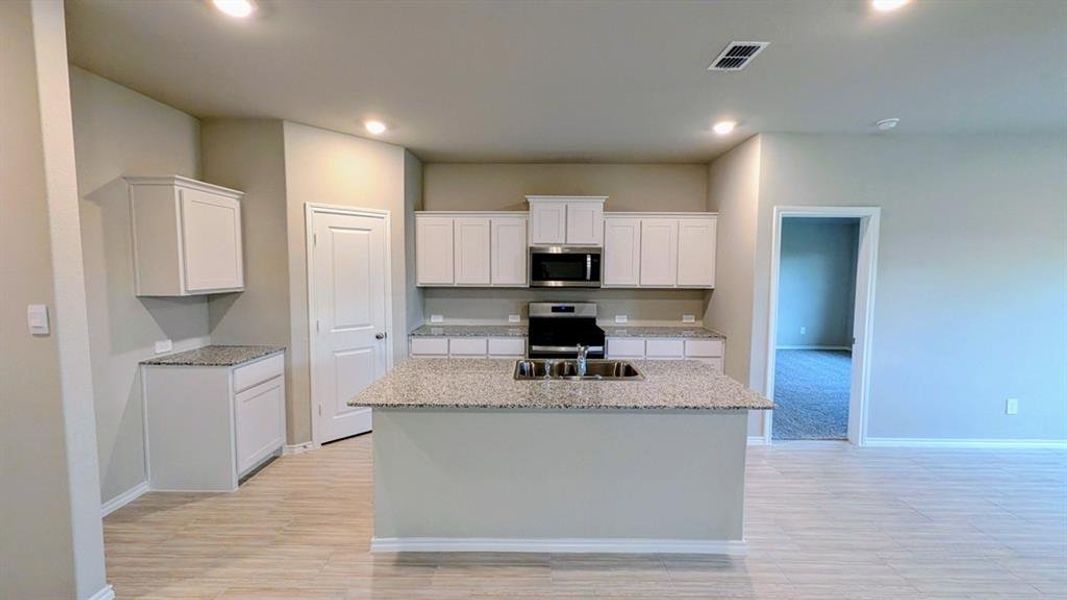 Kitchen - All Home and community information, including pricing, included features, terms, availability and amenities, are subject to change at any time without notice or obligation. All Drawings, pictures, photographs, video, square footages, floor plans, elevations, features, colors and sizes are approximate for illustration purposes only and will vary from the homes as built.