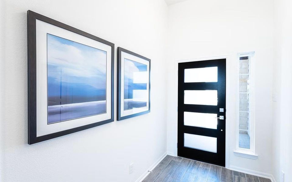 Welcoming interior entry and hallway highlighting the home’s bright atmosphere and thoughtful design, offering a smooth flow into the main living areas and setting a warm first impression as you step inside. **Photos are representative only and may vary as built.**