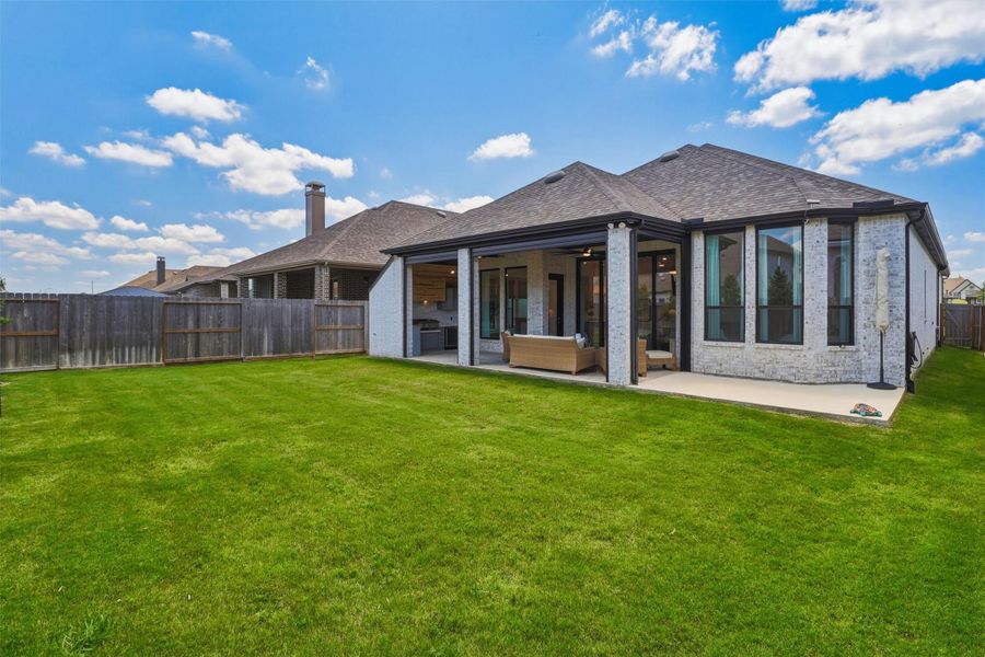 Exterior details and patio area of a home in , Brookshire (Image 32).