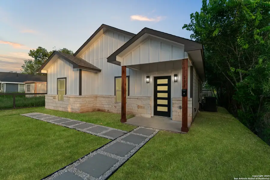 Front exterior of a new home in , Poteet, TX, highlighting curb appeal (Image 1). Front exterior of a new home in , Poteet, TX, highlighting curb appeal (Image 1).