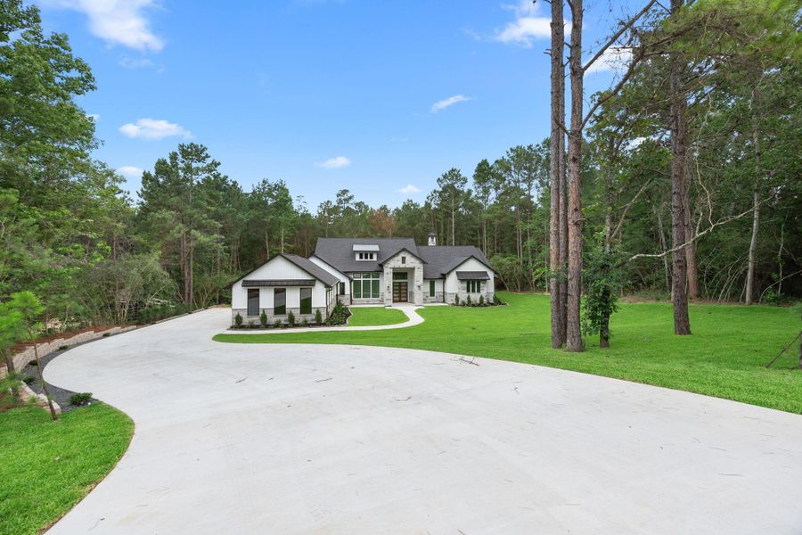 Front exterior of a new home in , Montgomery, TX, highlighting curb appeal (Image 26).
