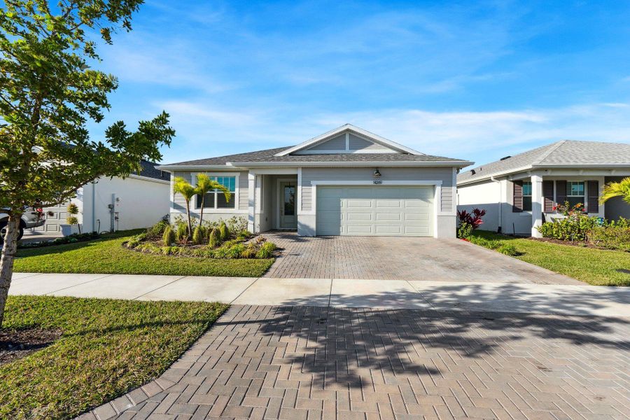 Front exterior of a new home in , Port St. Lucie, FL, highlighting curb appeal (Image 19). Front exterior of a new home in , Port St. Lucie, FL, highlighting curb appeal (Image 19).
