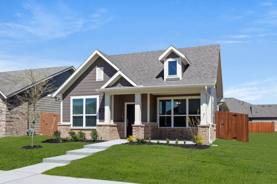 Front exterior of a new home in Heartland, Crandall, TX, highlighting curb appeal (Image 2). Front exterior of a new home in Heartland, Crandall, TX, highlighting curb appeal (Image 2).