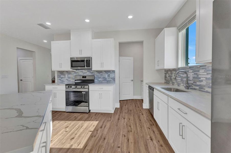 Furnished interior view inside a new home in , Port Charlotte (Image 9).