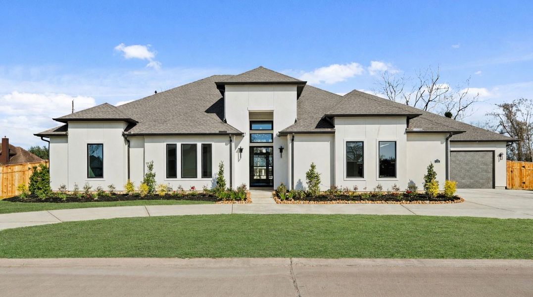 Front exterior of a new home in Weston Lakes, Fulshear, TX, highlighting curb appeal (Image 1). Front exterior of a new home in Weston Lakes, Fulshear, TX, highlighting curb appeal (Image 1).