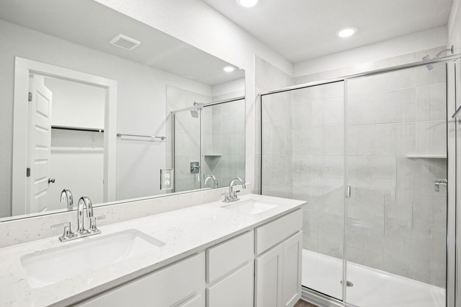 A bathroom with a glass shower.