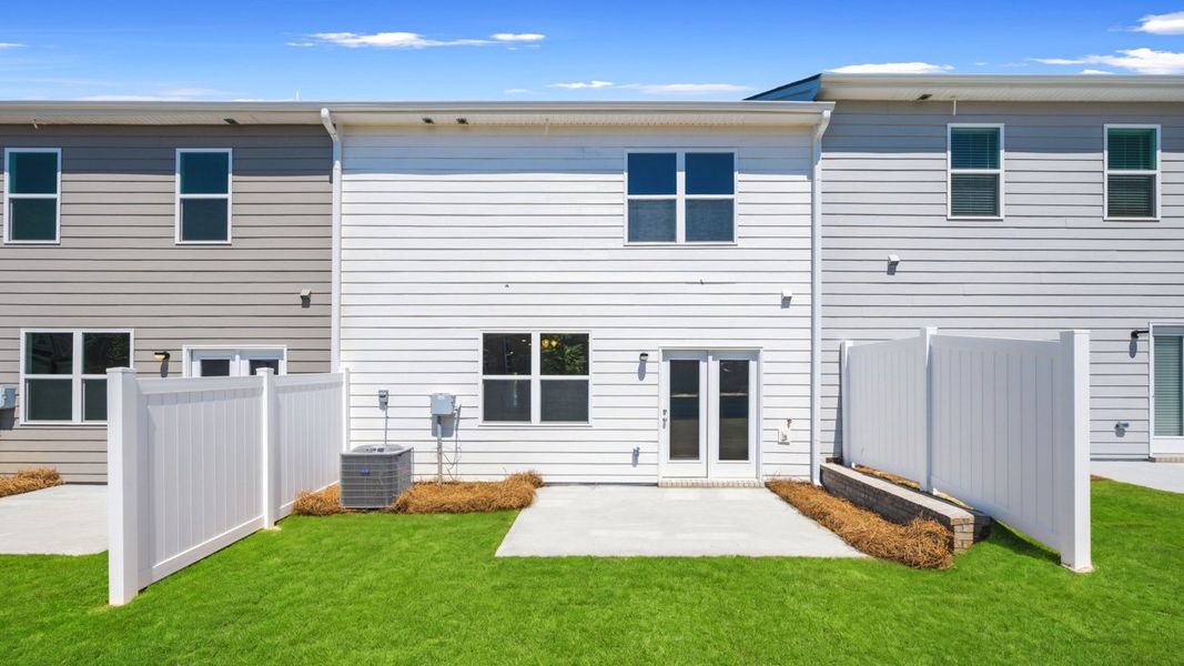 Exterior details and patio area of a home in Independence Villas and Townhomes, Loganville (Image 3).