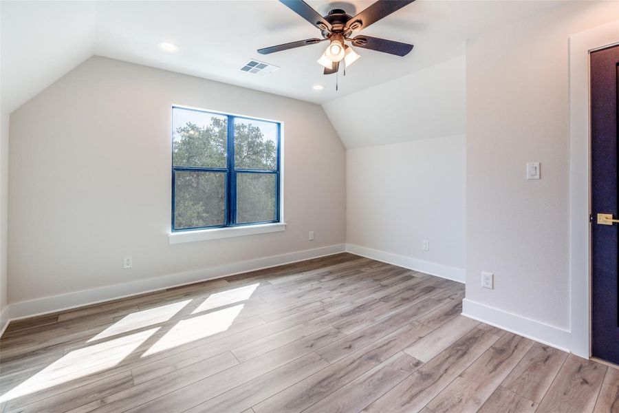 Bonus room with light wood-type flooring, recessed lighting, and ceiling fan