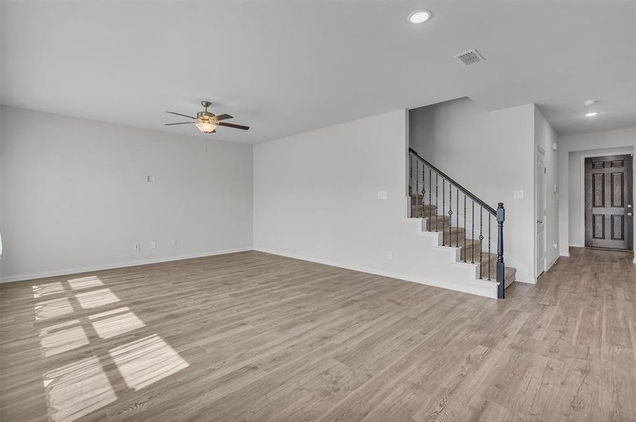 Empty room featuring light hardwood / wood-style floors and ceiling fan