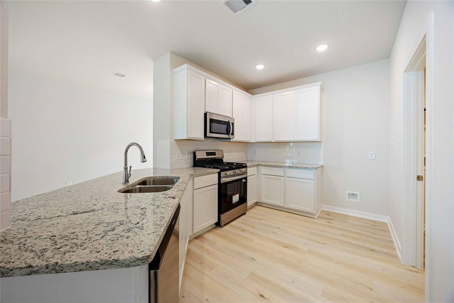 Furnished interior view inside a new home in Bluebonnet Village, Bellville (Image 6).