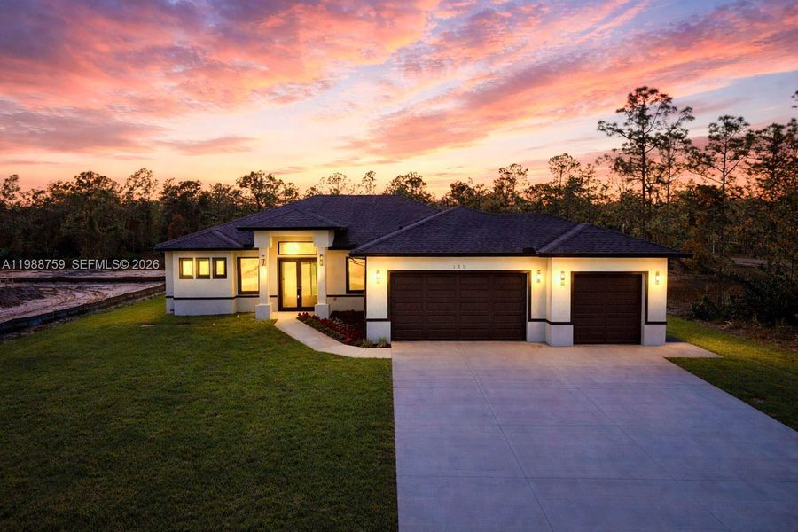 Front exterior of a new home in , Lehigh Acres, FL, highlighting curb appeal (Image 19). Front exterior of a new home in , Lehigh Acres, FL, highlighting curb appeal (Image 19).