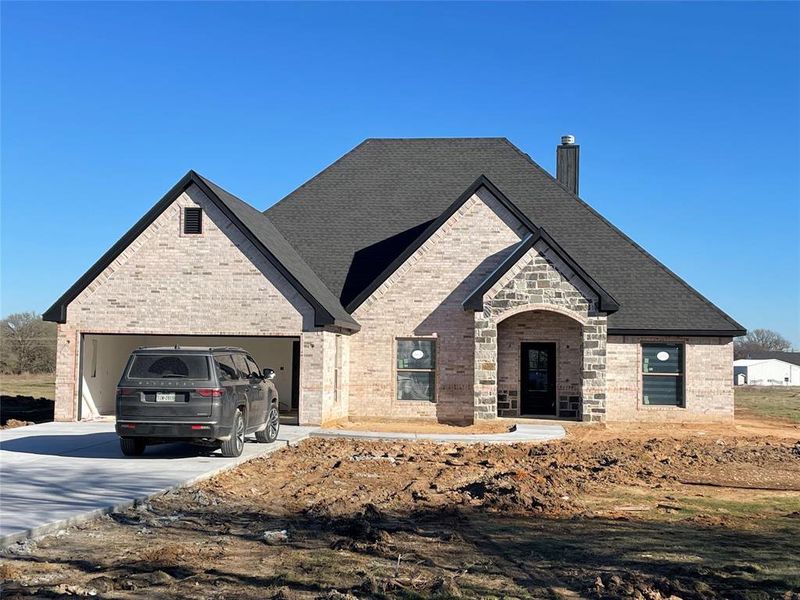 View of front of property featuring a garage