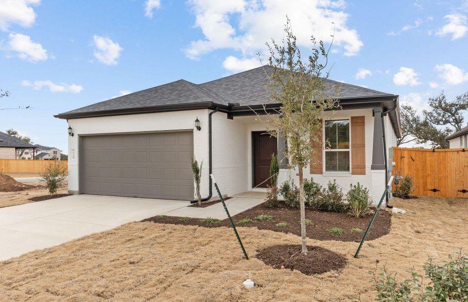Front exterior of a new home in Woodside, Georgetown, TX, highlighting curb appeal (Image 20).