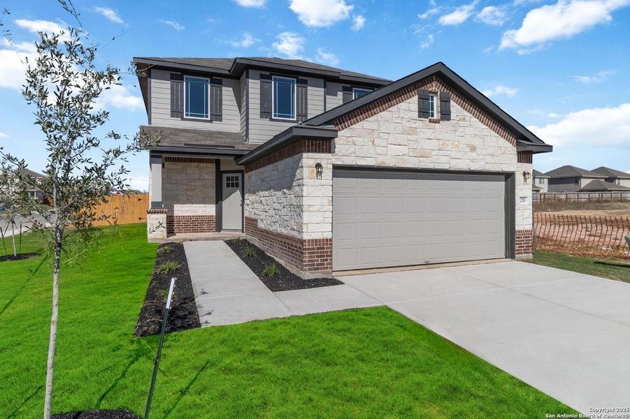 Front exterior of a new home in Applewhite Meadows, San Antonio, TX, highlighting curb appeal (Image 2). Front exterior of a new home in Applewhite Meadows, San Antonio, TX, highlighting curb appeal (Image 2).