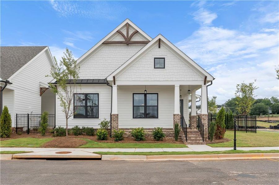 Front exterior of a new home in Promenade at Sawnee Village, Cumming, GA, highlighting curb appeal (Image 22).