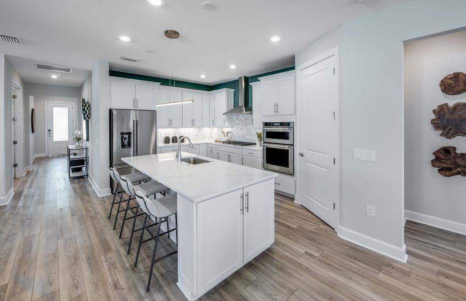 Large kitchen island with quartz countertops and w Large kitchen island with quartz countertops and w