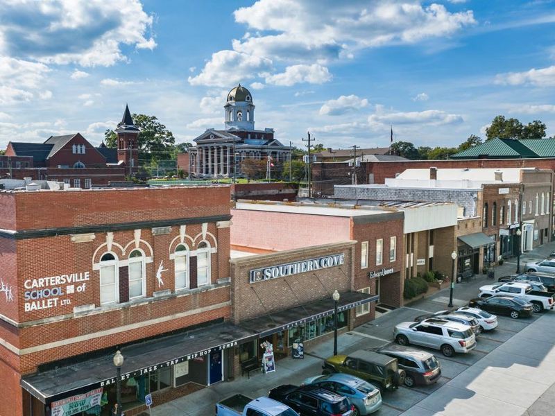 Front exterior of a new home in Parkside at Carter Grove, Cartersville, GA, highlighting curb appeal (Image 2).