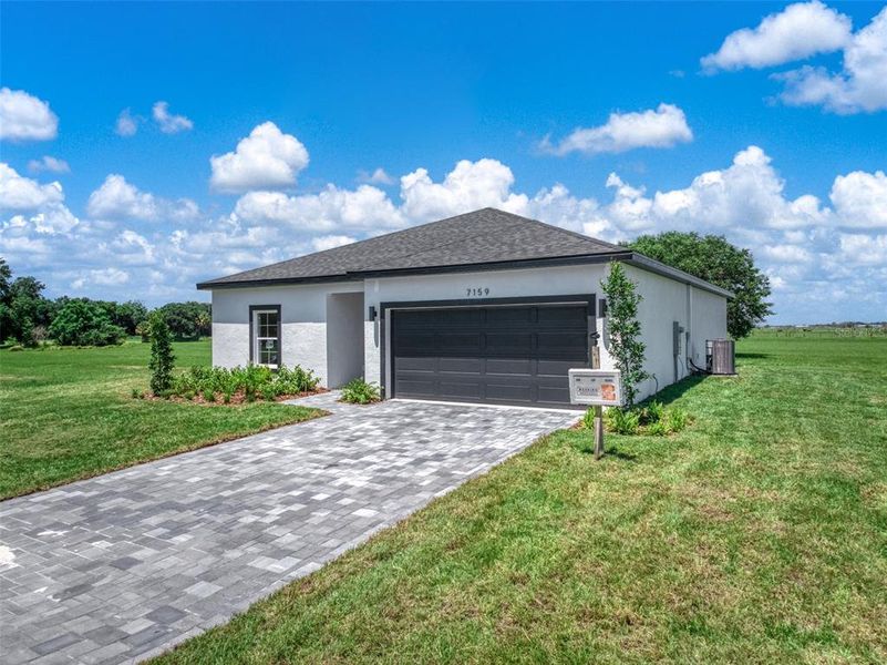 Front exterior of a new home in , Sebring, FL, highlighting curb appeal (Image 25).