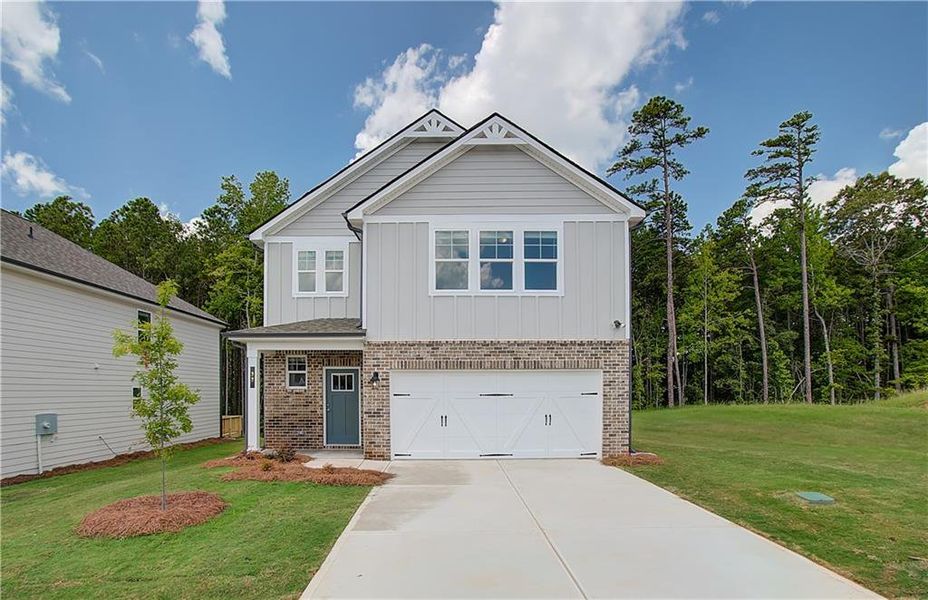 Front exterior of a new home in Enclave at Evergreen, Fairburn, GA, highlighting curb appeal (Image 12).