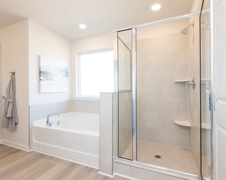 The primary bathroom also includes a walk-in shower and bathtub.