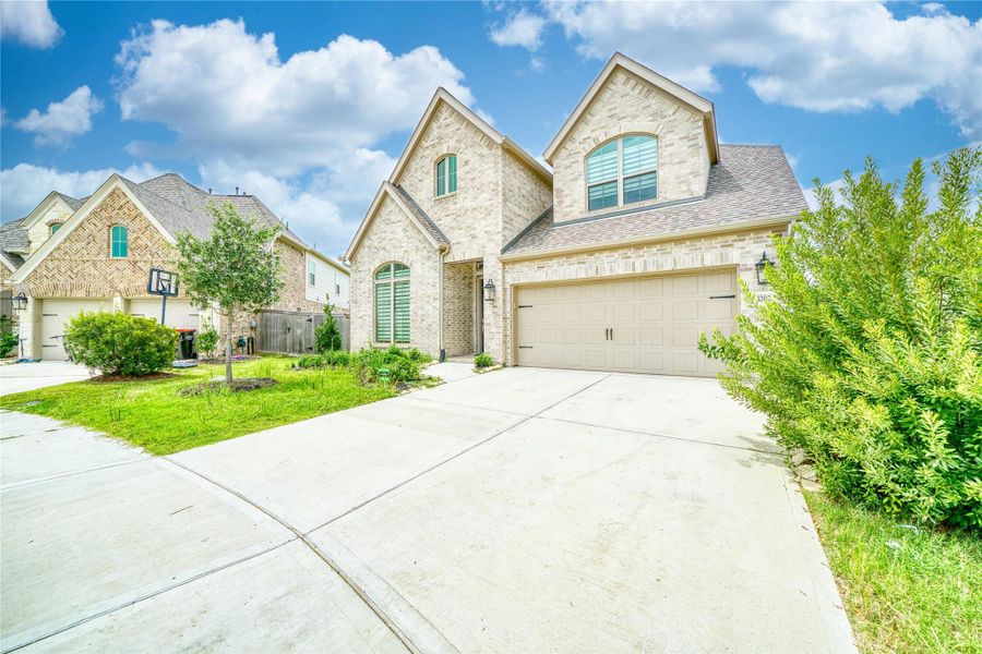 Front exterior of a new home in , Fulshear, TX, highlighting curb appeal (Image 2). Front exterior of a new home in , Fulshear, TX, highlighting curb appeal (Image 2).